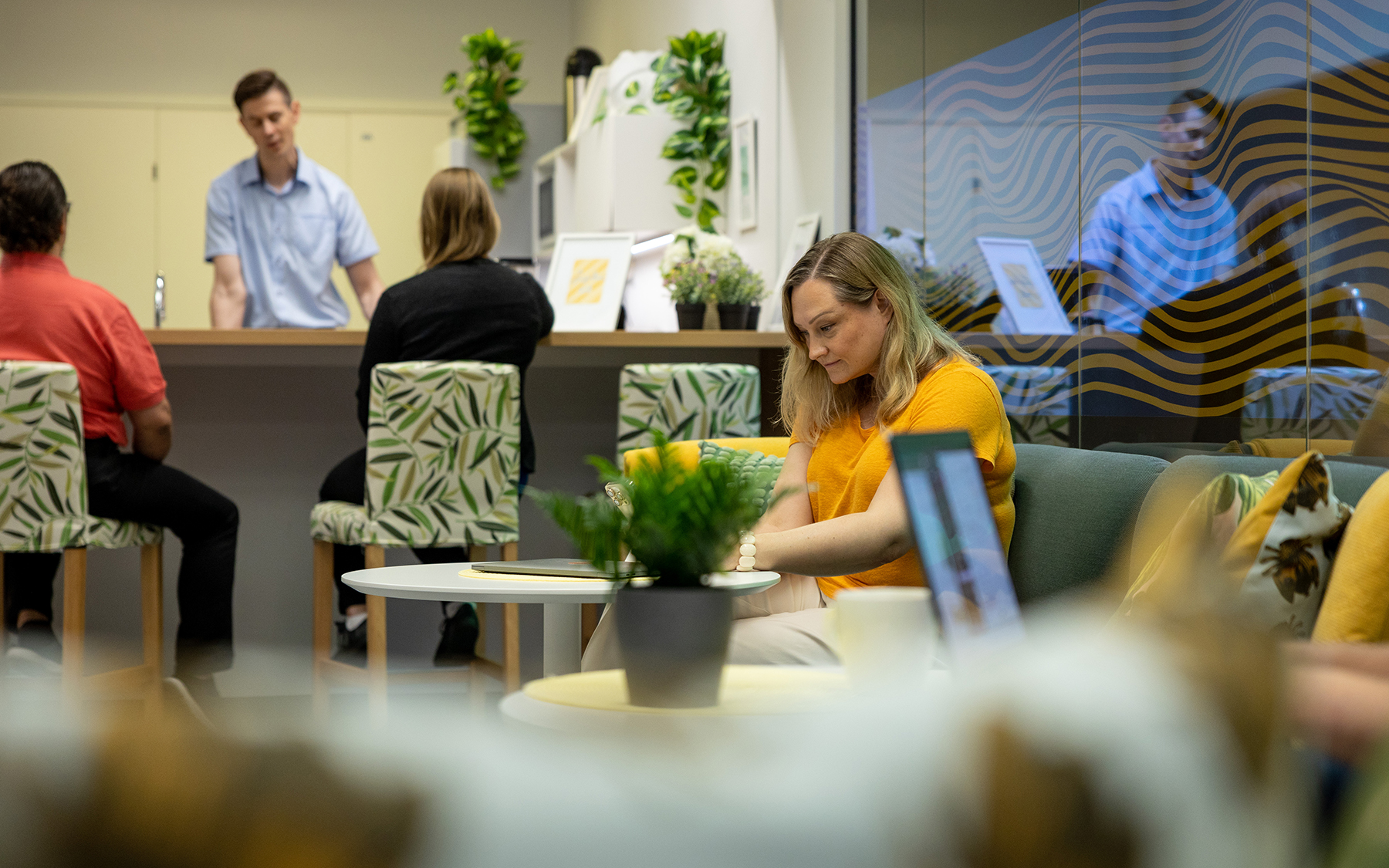 Woman looking at computer in office